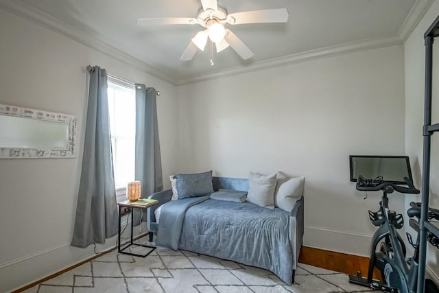 bedroom featuring ceiling fan and crown molding