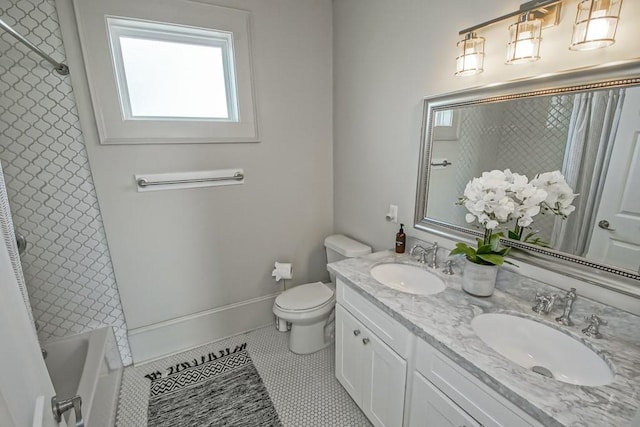 full bathroom with vanity, tile patterned floors, toilet, and tiled shower / bath