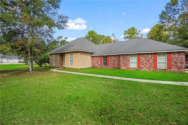 ranch-style home featuring a front lawn