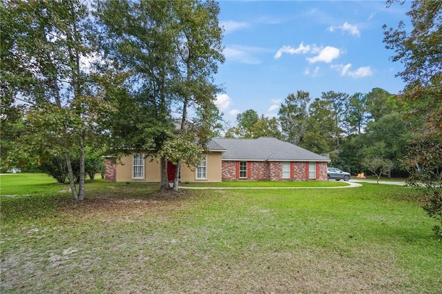 ranch-style home featuring a front yard