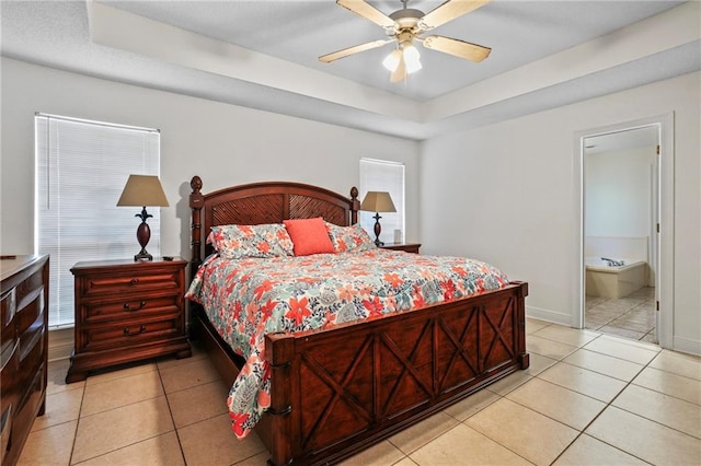 bedroom featuring ensuite bathroom, ceiling fan, and light tile patterned floors