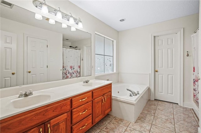 bathroom featuring vanity, tile patterned floors, and plus walk in shower