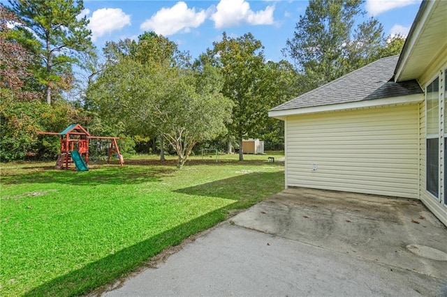 view of yard with a patio area and a playground