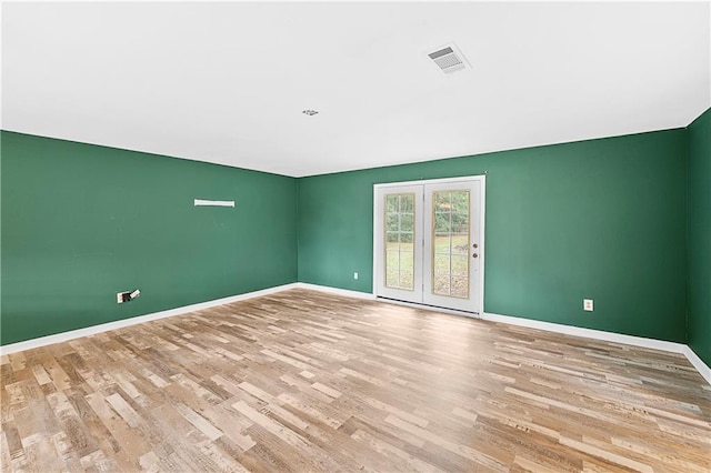 unfurnished room with light hardwood / wood-style floors