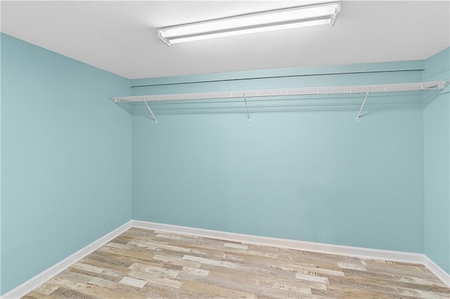 spacious closet with light wood-type flooring