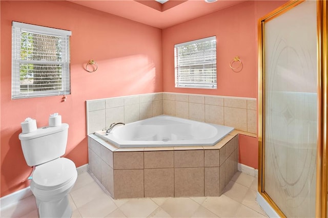 bathroom with tile patterned flooring, a healthy amount of sunlight, toilet, and shower with separate bathtub