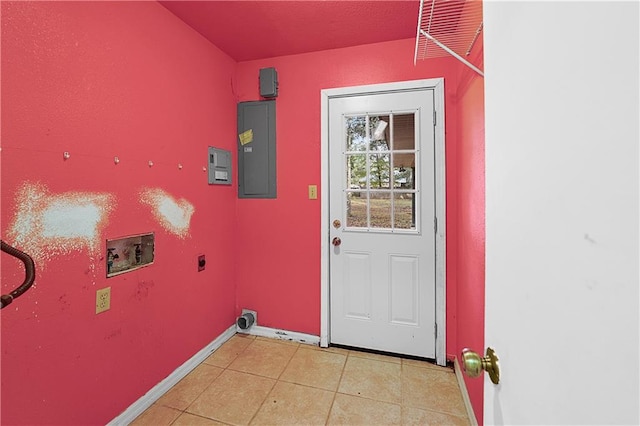 washroom featuring electric panel, hookup for a washing machine, light tile patterned flooring, and hookup for an electric dryer