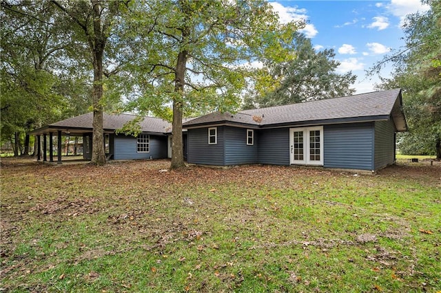 back of house featuring french doors and a yard