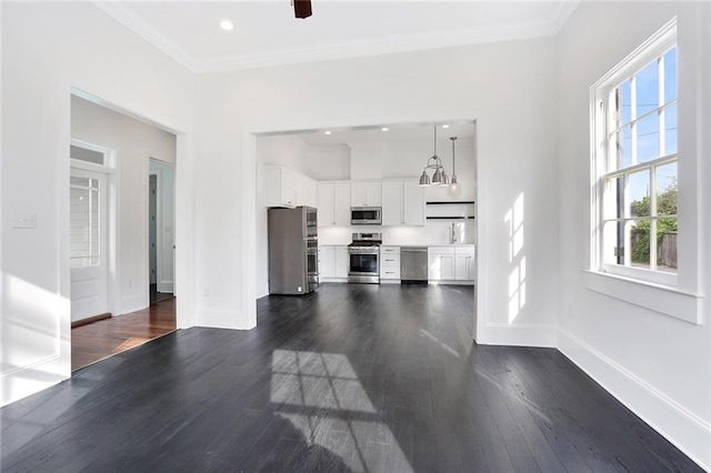 unfurnished living room with dark hardwood / wood-style flooring and ornamental molding