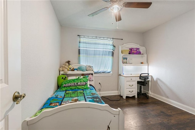 bedroom with ceiling fan and dark hardwood / wood-style floors