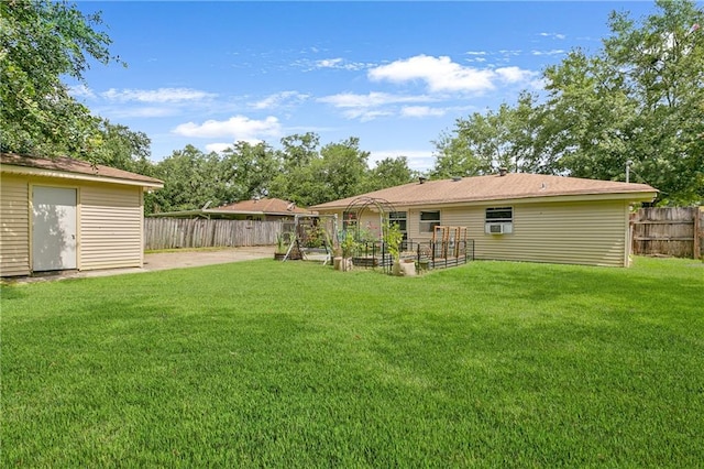 view of yard featuring a storage shed and a patio area