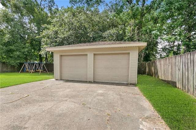 garage featuring a lawn