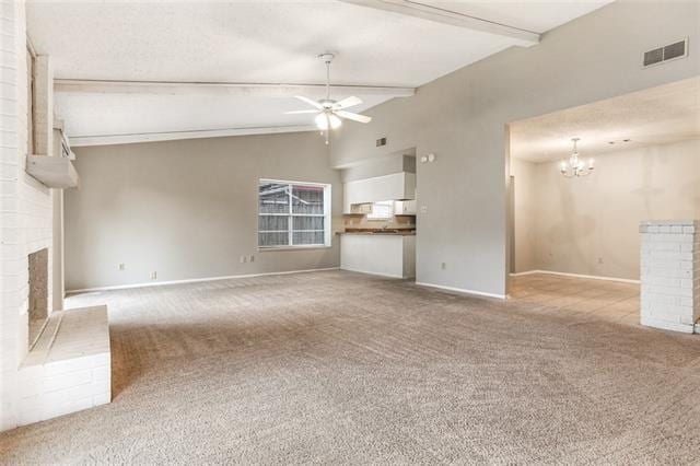 unfurnished living room featuring vaulted ceiling with beams, ceiling fan with notable chandelier, light colored carpet, and a fireplace