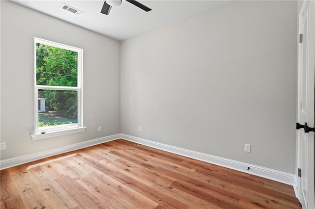 spare room featuring ceiling fan and light hardwood / wood-style flooring