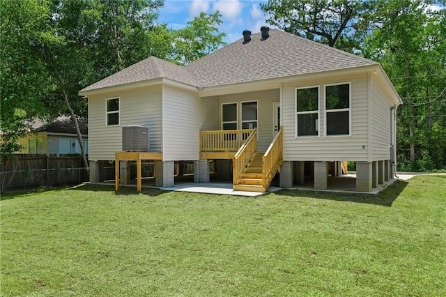 back of house with a yard and a patio area