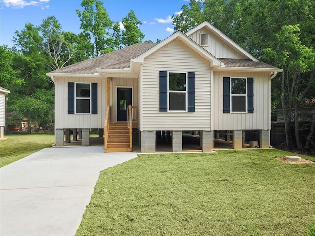 view of front facade with a front yard and a carport