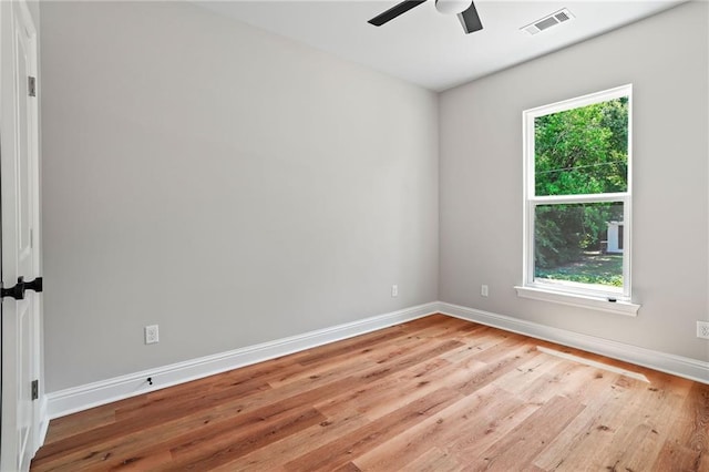 spare room with light hardwood / wood-style floors and ceiling fan