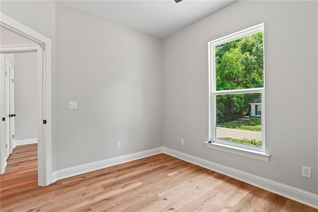 unfurnished room featuring light hardwood / wood-style floors