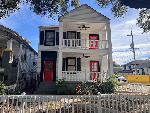 view of front of house featuring a porch, ceiling fan, and a balcony