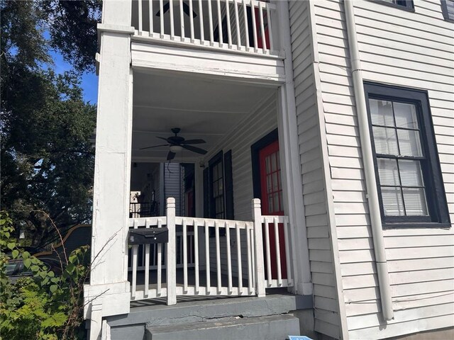 3633 Franklin Ave, New Orleans, LA 70122 - view of side of home featuring a ceiling fan, a balcony, and covered porch
