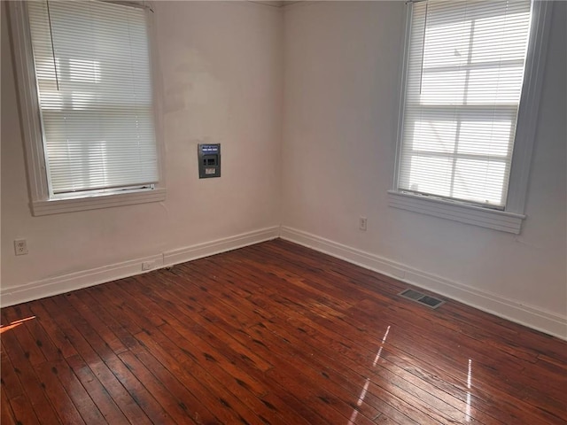 3633 Franklin Ave, New Orleans, LA 70122 - spare room with baseboards and dark wood-style flooring