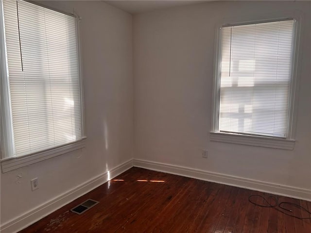 3633 Franklin Ave, New Orleans, LA 70122 - spare room with baseboards and dark wood-style floors