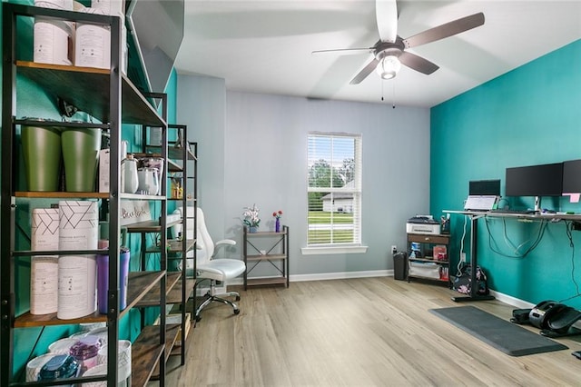 home office featuring hardwood / wood-style flooring and ceiling fan