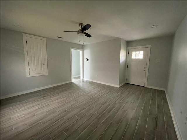 foyer entrance featuring light hardwood / wood-style floors and ceiling fan