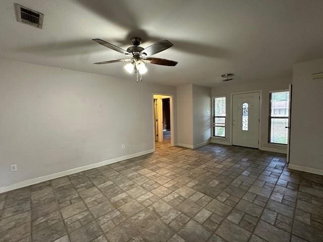 interior space featuring ceiling fan