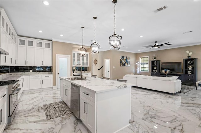 kitchen with a sink, marble finish floor, visible vents, recessed lighting, and appliances with stainless steel finishes