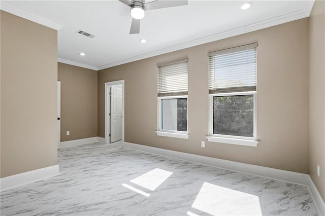 empty room with crown molding, marble finish floor, baseboards, and recessed lighting
