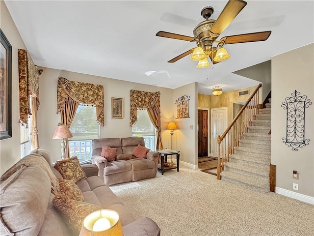 living room with ceiling fan and light colored carpet