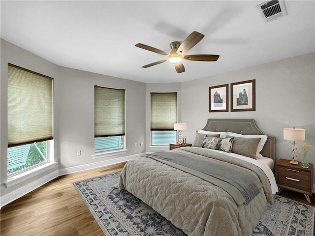 bedroom with ceiling fan and light wood-type flooring