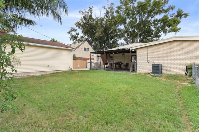 view of yard featuring cooling unit and a patio