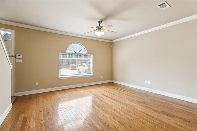 spare room with ceiling fan, light hardwood / wood-style flooring, and crown molding