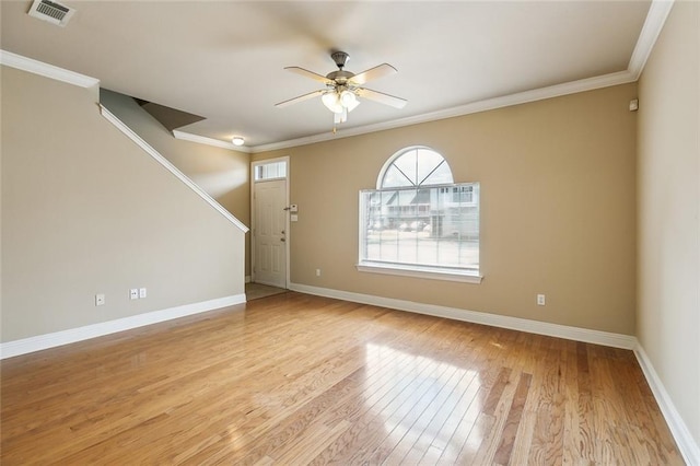 interior space with light hardwood / wood-style floors, ceiling fan, and ornamental molding