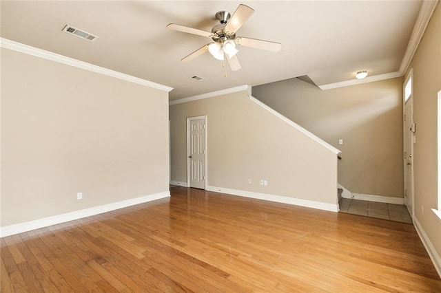 unfurnished living room with light hardwood / wood-style floors, ceiling fan, and crown molding