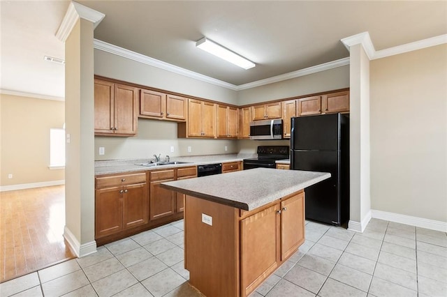 kitchen featuring black appliances, sink, crown molding, and a center island