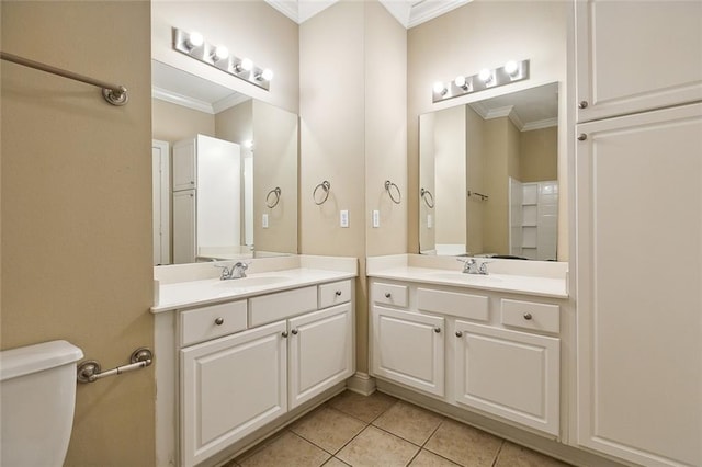 bathroom with toilet, tile patterned floors, and crown molding