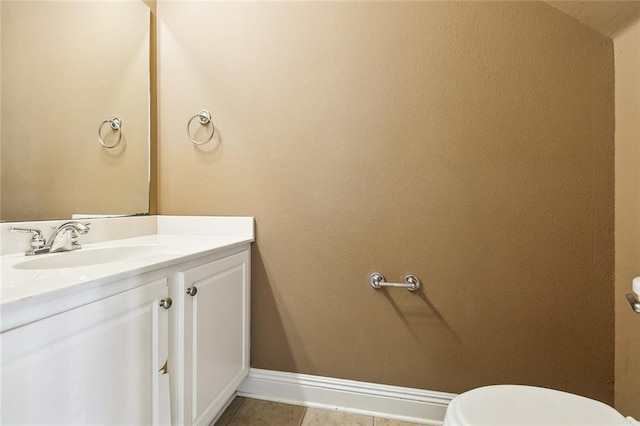 bathroom with vanity, tile patterned floors, and toilet