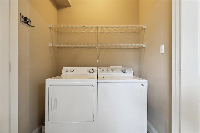 laundry area with independent washer and dryer