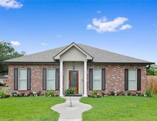 ranch-style house with a front lawn