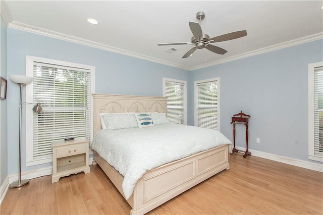 bedroom with multiple windows, crown molding, ceiling fan, and light hardwood / wood-style flooring