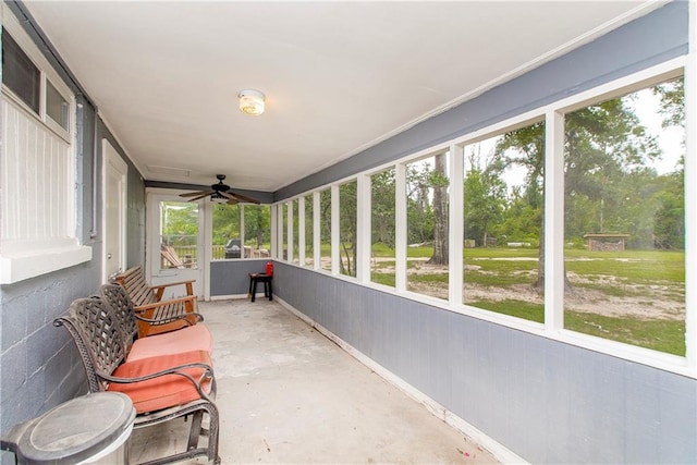 sunroom featuring a wealth of natural light and ceiling fan