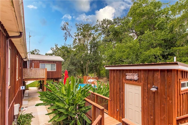 wooden deck with a shed