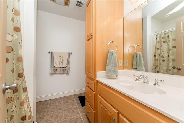 bathroom with vanity and tile patterned floors