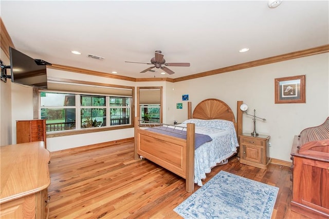 bedroom featuring ornamental molding, hardwood / wood-style flooring, and ceiling fan