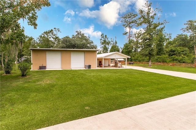 exterior space with a garage and an outbuilding