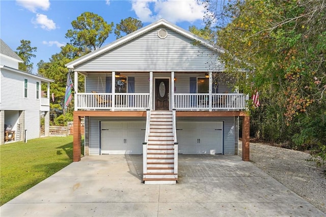 view of front facade with a front lawn, a porch, and a garage