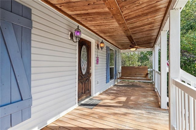 wooden terrace with a porch